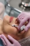 pexels-photo-7582560-7582560 Close-up of a beautician administering a Botox injection to a woman at a clinic.